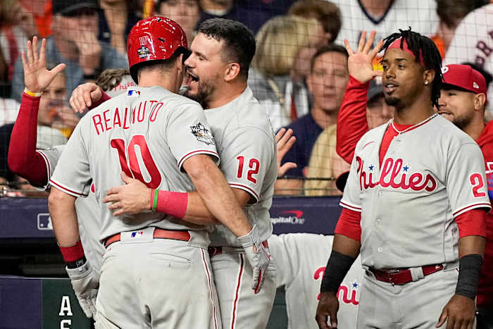 J.T. Realmuto and Kyle Schwarber celebrate Realmuto’s go-ahead home run in Game 1 of the World Series.